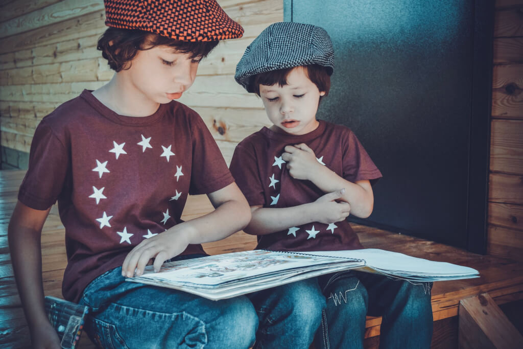 two-boys-reading-a-book-1564886